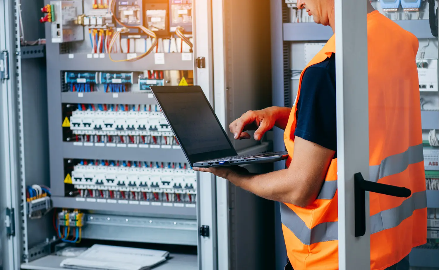man-safety-vest-is-using-laptop